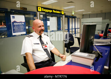 Passport control. HM UK Border Agency, Manchester Airport. Stock Photo