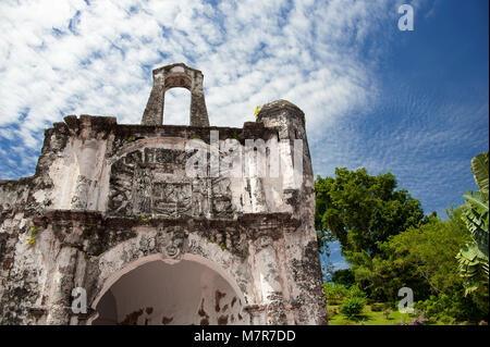 Close up Porta de Santiago, gate house, and only remaining part of A Famosa Portugese fortress in Malacca, Malaysia. Stone building, blue cloud sky Stock Photo