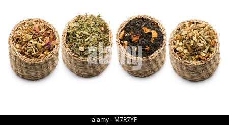 variety of tea blend in straw baskets on white background Stock Photo