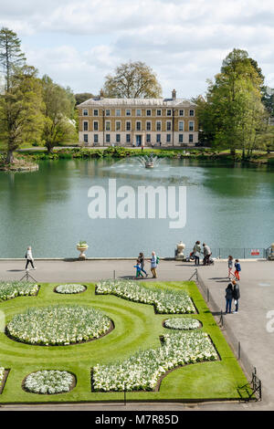 London, UK - April 18, 2014. Museum No 1 and lake in Kew Botanic Gardens. The gardens were founded in 1840 and are of international significance for b Stock Photo