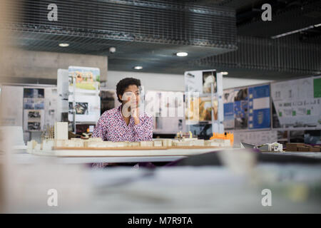 Female architect dreaming of plans Stock Photo