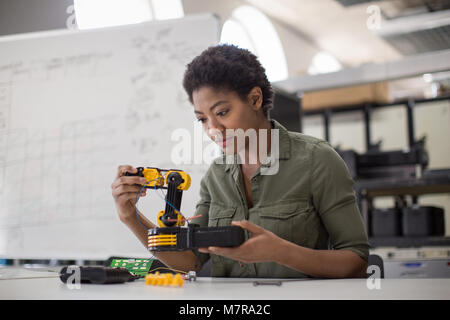 Female working on robotics Stock Photo
