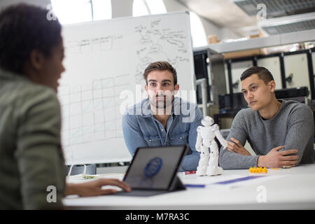 Team working on robotic technology Stock Photo