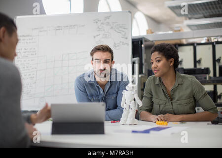 Team working on robotic technology Stock Photo