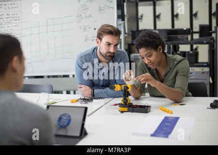 Team working on robotic technology Stock Photo