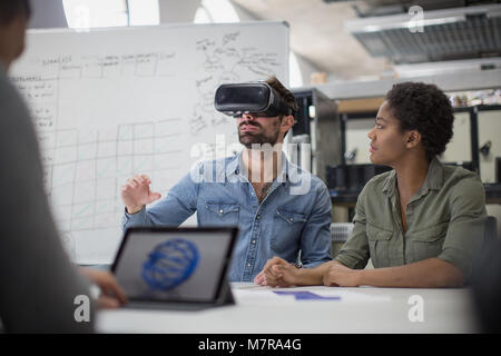 Team working on virtual reality headset Stock Photo