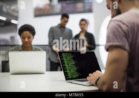 Coders working in an office Stock Photo