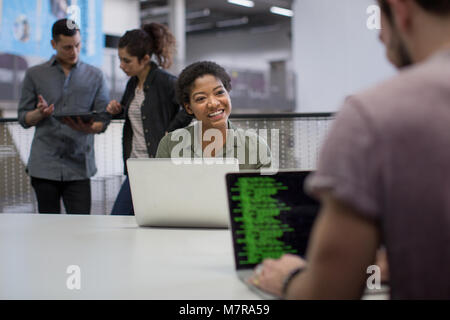 Coders working in an office Stock Photo