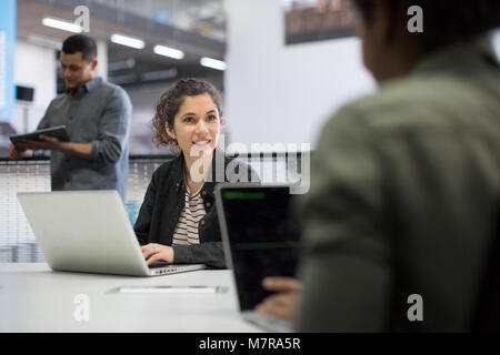 Coders working in an office Stock Photo