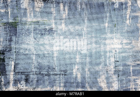 Grunge abstract urban collage, torn paper with letters on scratched and painted background Stock Photo