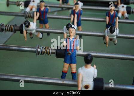 Figures of football players from metal, in blue-red form. Table soccer. Stock Photo