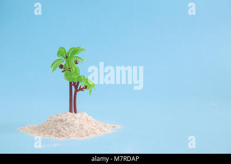 Desert island on pastel blue background minimal concept Stock Photo