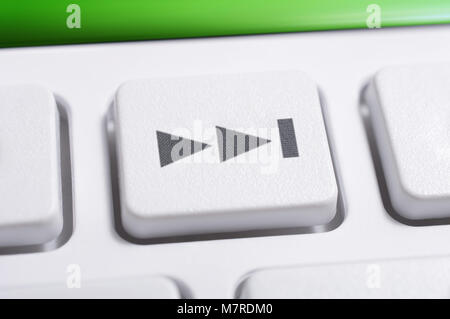 Macro Of A White Skip Forward Button Of A White Remote Control For A Hifi Stereo Audio System Stock Photo