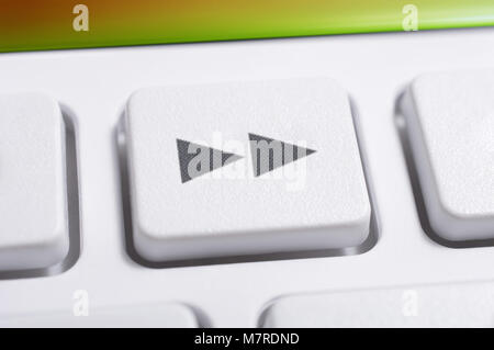 Close Up Of A White Fast Forward Button Of A White Remote Control For A Hifi Stereo Audio System Stock Photo