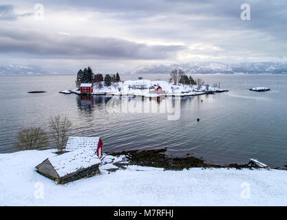 Winter on a small farm on a small island in the Norwegian fjord, Hardangerfjorden. Stock Photo