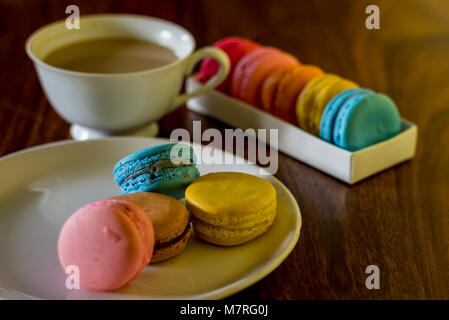 Delicious macaroons on the wooden table, with copy space Stock Photo