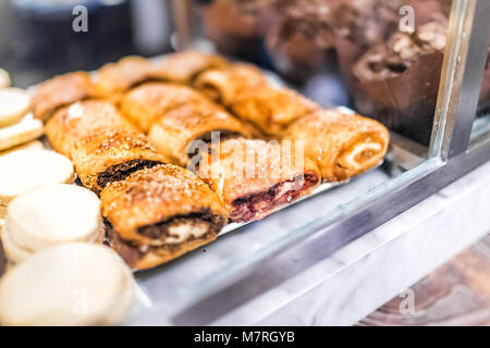 Closeup of Israel Jewish rugelach pastries on display in bakery filled with chocolate, raisins, walnuts, cinnamon, sugar, apricot, raspberry, nuts coo Stock Photo