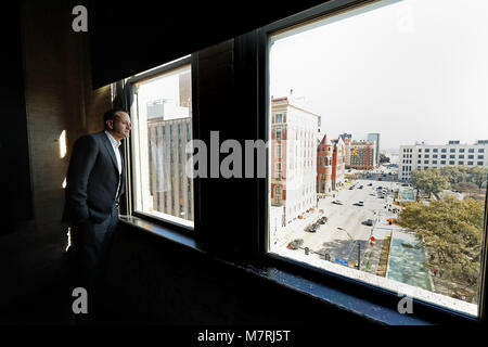 Taoiseach Leo Varadkar looks out of the 7th floor window of the Dallas County Administration Building in Dealey Plaza, downtown Dallas, a floor above the vantage point of the assassination of John F. Kennedy on November 22, 1963, known then as the Texas School Book Depository, as part of his visit to the United States. Stock Photo