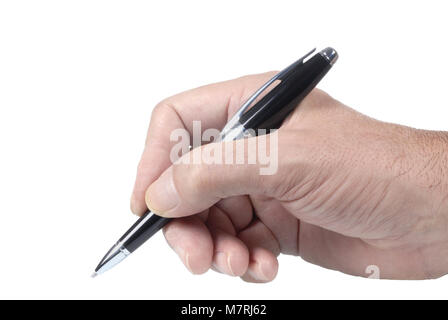 Black ballpoint pen held in a writing position by a male hand isolated on a white background. Stock Photo