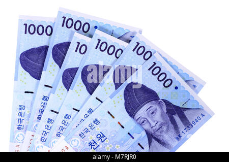 Several Korean 1000 Won currency bills isolated on a white background. Stock Photo