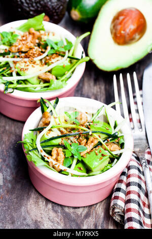 Healthy  green vegetarian salad with zucchini spaghetti and avocado Stock Photo