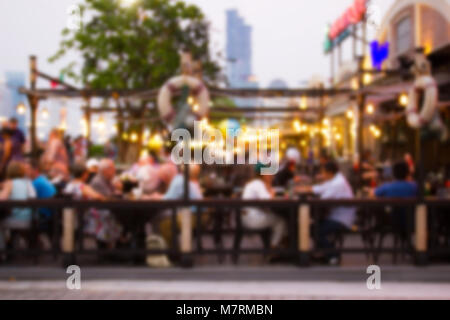 abstract blur image of night festival in a restaurant and The atmosphere is happy and relaxing with bokeh for background Stock Photo