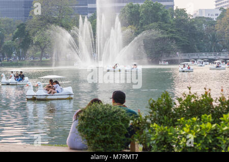 Bangkok Thailand: January 28, 2018:- People relax on a boat in a city park  in Lumpini Park Bangkok Thailand. Stock Photo