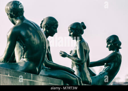 Three girls and a boy sculptures at bank of Spree River opposite Berlin Cathedral by Wilfried Spitzenreiter