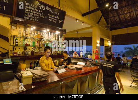 FCC - bar staff at the Foreign Correspondents Club, Phnom Penh, Cambodia Asia Stock Photo