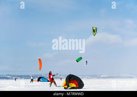 PERM, RUSSIA - MARCH 09, 2018: snowkiters rides on the ice of a frozen river