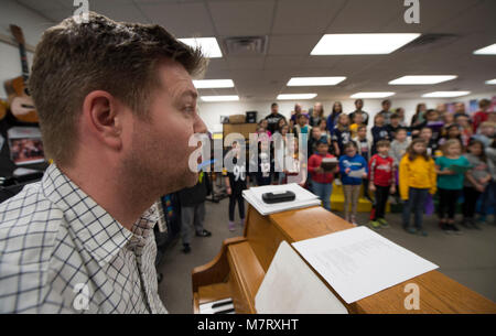 UNITED STATES: March 12, 2018: Cool Spring Elementary School music teacher Luke Denton works with his 4th and 5th grade chorus students who will be pe Stock Photo