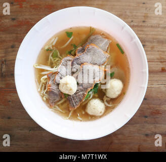 Asian noodle soup on a wooden table Stock Photo