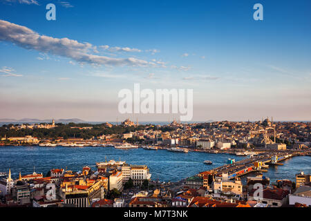 Istanbul city at sunset in Turkey, Sultanahmet and Eminonu districts seen from Beyoglu and Galata Bridge on Golden Horn. Stock Photo