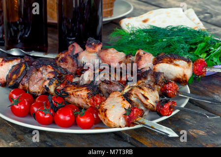 appetizing tasty shish kebab with vegetables on skewers close-up Stock Photo