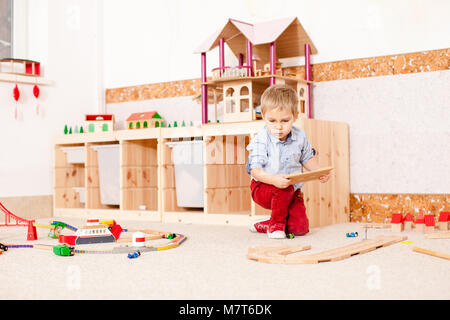 Boy plays with train  Stock Photo