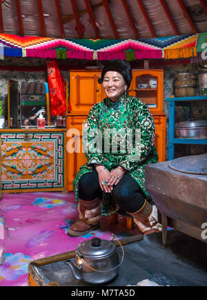 Hatgal, Mongolia, 2nd March 2018: mongolian woman in the kitchen of her family ger (yurt) Stock Photo