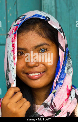 Blue- and green eyed young woman of the Cham Muslim minority people in Central Vietnam. Stock Photo