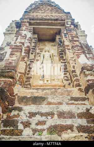 Below view of a whiute budha carved in a wall in the main Prang at Wat Racha Burana, Ayudhya Province Stock Photo