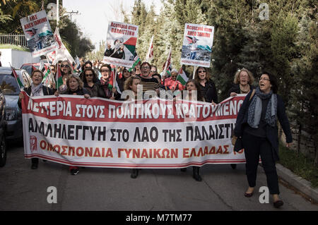 January 1, 2006 - Athens, Greece - Demonstrators seen holding several palestinian flags and a large banner march toward the Palestinian embassy in Athens during a protest to demand the release of a 16-year-old Palestinian girl named Ahed Tamimi, held in Israeli military detention. The start of a military trial for the Palestinian teenager has been delayed until February 6 after a viral video showed her hitting two Israeli soldiers. (Credit Image: © Nikolas Joao Kokovlis/SOPA Images via ZUMA Wire) Stock Photo