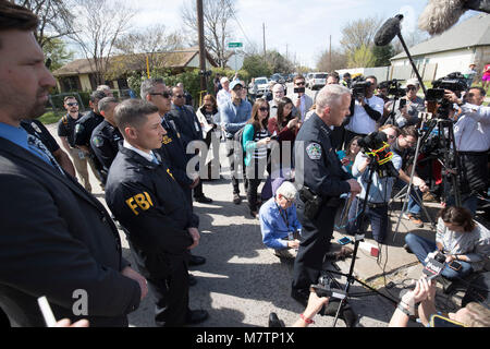 Austin interim police chief Brian Manley speaks to the media in an east Austin neighborhood where a third package bomb exploded Monday that severely injured an elderly woman. The incident followed bombings two weeks ago and earlier Monday that killed two people. Stock Photo