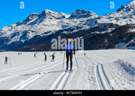 Cross-country skier in a ski trail of the Engadin Skimarathon, St. Moritz, Engadin, Grisons, Switzerland Stock Photo