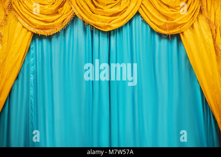 Theater stage with yellow curtains Stock Photo