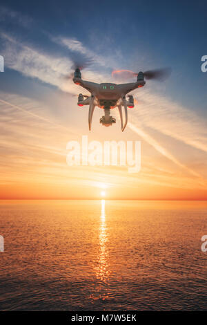 Beautiful morning over the sea and flying drone. Stock Photo