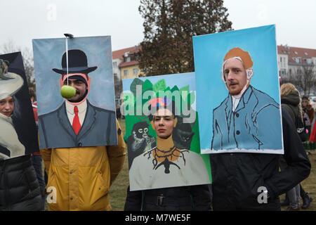 Carnival participants dressed as the painting by René Magritte (L), the self portrait by Frida Kahlo (C) and the self portrait by Vincent van Gogh (R) attend the Roztocký Masopust in Roztoky near Prague, Czech Republic. Masopust means 'farewell to meat' in Czech language. This popular festival celebrates throughout the Czech Republic before the Lent. One of the most spectacular Masopust carnivals takes place annually in the small town of Roztoky just outside Prague. Stock Photo