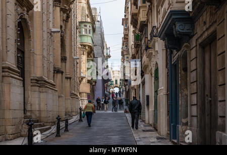 View of the Old Theatre Street, in Valletta, Malta, on a winter evening. Stock Photo