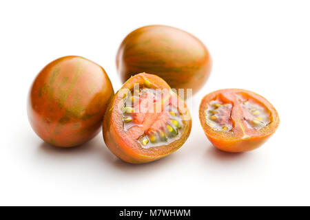 Tasty cherry tomatoes isolated on white background. Stock Photo