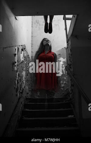 The suicide girl ghost in red dress show up after death Stock Photo