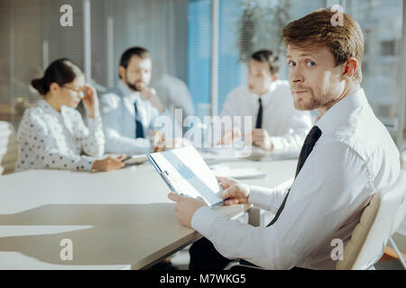 Pleasant manager posing while participating in meeting Stock Photo