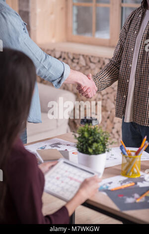 Close up of a handshake between two people Stock Photo