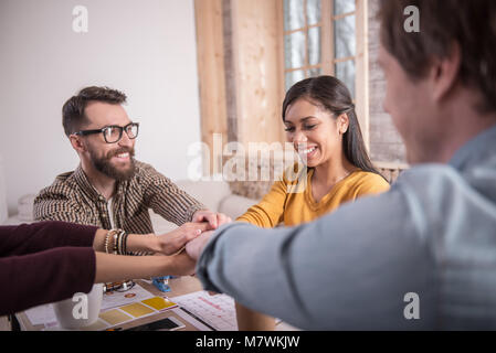 Joyful positive people showing their unity Stock Photo